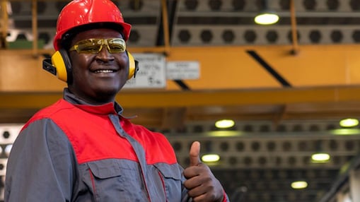 Three employees reviewing plans