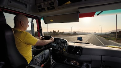 truck driver driving on empty road