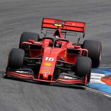 A red Scuderia Ferrari sits on a racing track, an example of Shell Helix Ultra’s Innovation Partnership