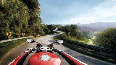 Man riding a bike which is using the Superior Engine Oil For Bikes