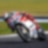 ducati superbike with rider cornering at speed on a racetrack